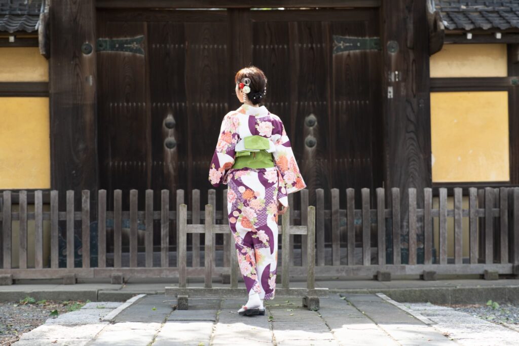 A singer-songwriter in traditional kimono at a Shinto shrine, embodying the essence of Japanese culture.